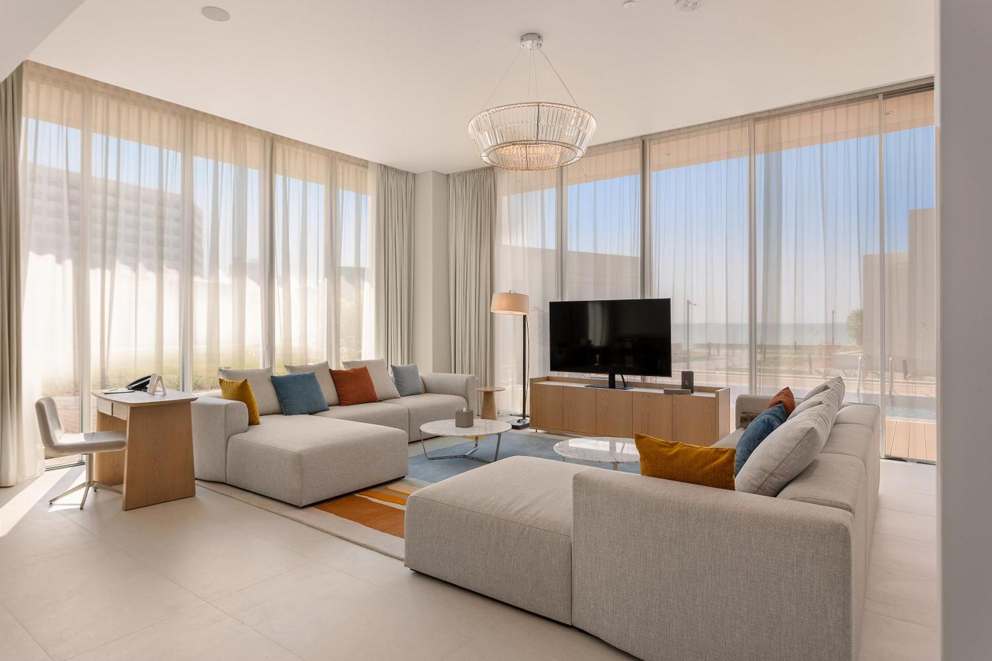 Ajman Hotel & Villas By Blazon Hotels Ngoại thất bức ảnh The living room of a three-bedroom villa at The Edition
